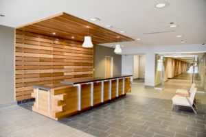 Corporate welcome desk featuring lots of wooden beam work