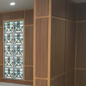 Wood panel walls with stained glass