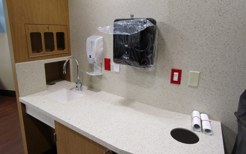 Sink area in patient suite in hospital